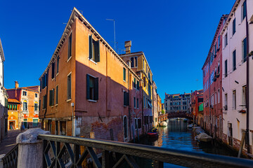 Fototapeta na wymiar Picturesque view of canals in romantic Italian city of Venice in sunny summer day.