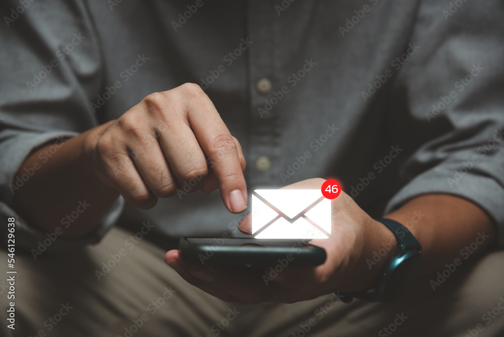 Poster businessman using smartphone with popup icon email and notification for business e-mail and communic