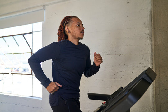 man running on treadmill at brisk pace