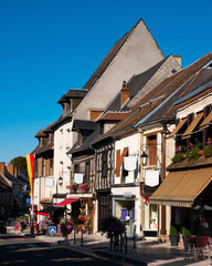Obraz premium View of typical street in old historic district of Aubigny-sur-Nere town in France on summer day overlooking ancient wooden timber-framed houses