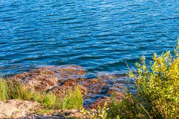 Mountain Lake with trees and rocks in British Columbia, Canada.