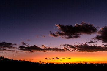 Fototapeta premium Sunset in the sky with clouds, Awesome epic landscape. Amazing vibrant colors im Brazil