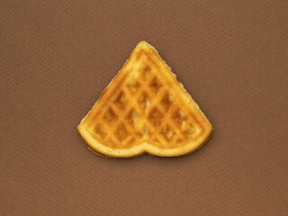 Triangular pastry on a dark brown background.