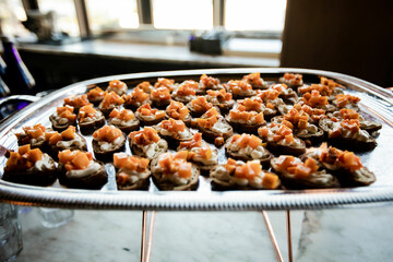 Large platter of sweet potato crostini on a silver platter