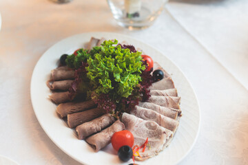 Catering table, beautifully decorated banquet with variety selection of different food snacks and appetizers on a corporate birthday party event or wedding celebration, delicatessen setting