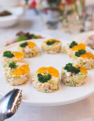 Catering table, beautifully decorated banquet with variety selection of different food snacks and appetizers on a corporate birthday party event or wedding celebration, delicatessen setting