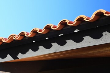 Fototapeta na wymiar Tile roof with clay terracotta 