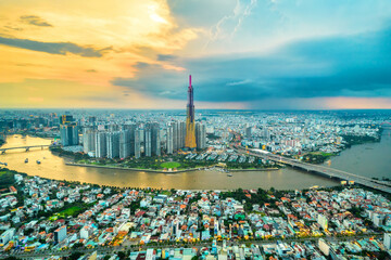 Top view aerial of center Ho Chi Minh city, Vietnam, beauty skyscrapers along river urban development, transportation, energy power infrastructure. Financial, travel and business concept.