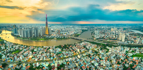 Top view aerial of center Ho Chi Minh city, Vietnam, beauty skyscrapers along river urban development, transportation, energy power infrastructure. Financial, travel and business concept.