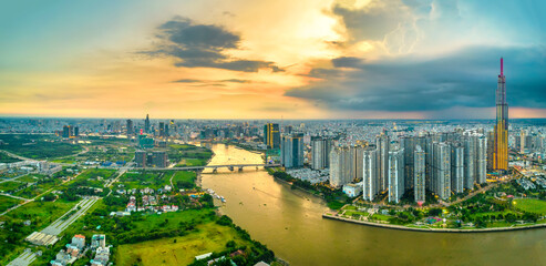 Fototapeta na wymiar Top view aerial of center Ho Chi Minh city, Vietnam, beauty skyscrapers along river urban development, transportation, energy power infrastructure. Financial, travel and business concept.