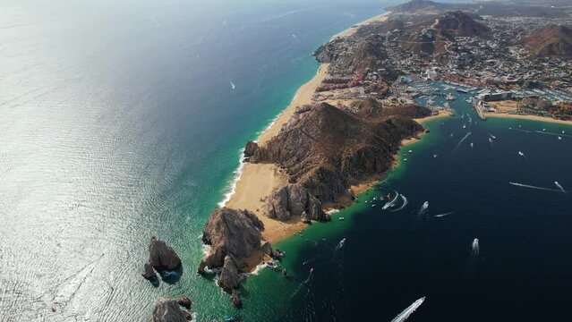 Aerial overview of the rocky arch of Cabo San Lucas, Mexico - reverse, drone shot