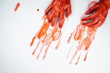 Female hands in blood on a white background. 