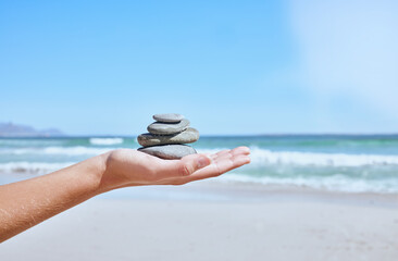 Rock balance, hand and beach for meditation, yoga or peace exercise in nature by water, Hands...
