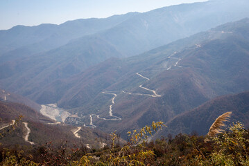 Panoramic view of mountains, windy roads and valleys