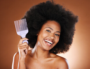 Beauty, hair and afro and black woman and comb for self care, natural and freedom. Happy, smile and...