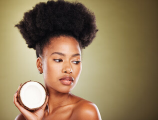Coconut, beauty and black woman in studio for natural hair care, skincare and healthy product...