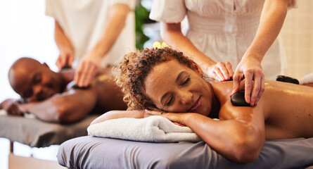 Spa, wellness and massage for couple and hot stone therapy, massage therapist hands for stress...