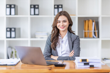 Young business Asian woman Accounting using calculating income-expenditure and analyzing real estate investment data report Financial and tax systems concept.	