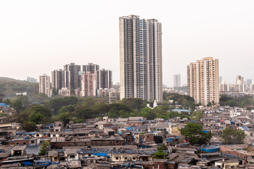 A skyline cityscape of Kandivali with high rise skyscrapers rising above slums.