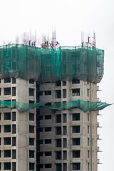 Safety nets and scaffolding on a tall high rise building under construction in the city of Mumbai. © Balaji
