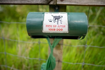 dog poop bags in a park dispenser