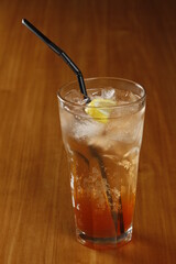 Iced tea glass with black straw