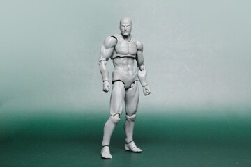 Fototapeta na wymiar male toy model body standing full body. PVC human body figure toy