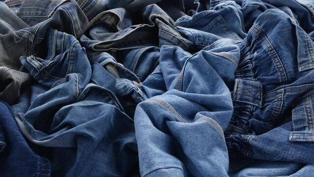 The Blue Jeans, Old denim clothing. Recycle Textile Waste. Fashion industry textile waste problem