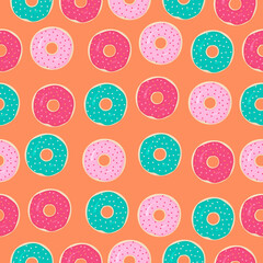 Seamless pattern with colored donuts on orange background