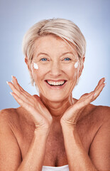 Beauty, portrait of mature woman and cream for skincare, anti aging and wellness on a grey studio...