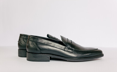 Black men shoes on the white background. Shoot from side of shoes and able to added text on the...