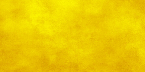 Gold texture for design background. Yellow color backdrop. Art plaster. Illuminated surface. Abstract image. 