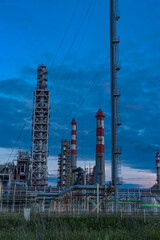 modern oil refinery against the background of the sky and clouds