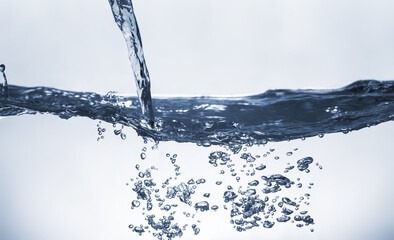 Water splash Aqua flowing in waves and creating bubbles Drops on the water surface feel fresh and...