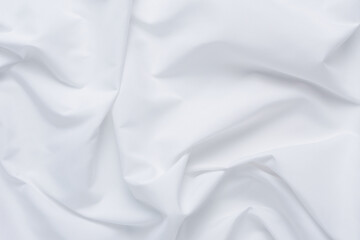White fabric. luxurious white fabric texture background. Creases of satin, silk, and cotton.