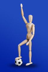 Football wooden toy figure on blue