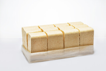 fuel briquettes are blocks of compressed biomass material such as farming waste.