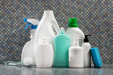 Cleaning supplies tools, white soap packaging, detergents in the bathroom