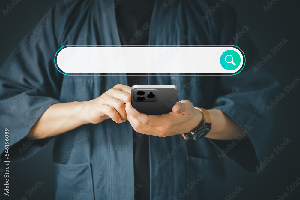 Fototapete Man using a smartphone in the room for searching browsing internet data information. Business concept for mobile phone using search with your website.