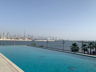 Large infinity pool with a view of the Dubai skyline in the United Arab Emirates