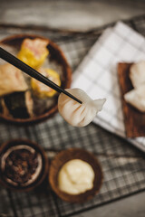 Traditional Asian Prawn or shrimp dumplings hakau, ha kauw. Served with sauce chilli oil and mayonnaise and chopstick