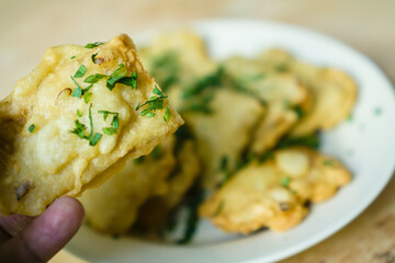 The Mendoans, a traditional food from soybean with flour, served in white plate