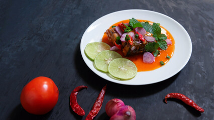 Canned fish salad on a dark background. Select focus.
