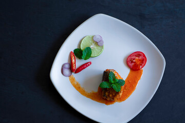 Salad of canned fish on dark background