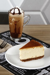 New York style cheesecake slice with dark choco frappe