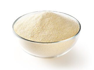 Semolina flour in glass bowl isolated on white background