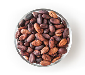 Uncooked cocoa beans in glass bowl isolated on white background with clipping path