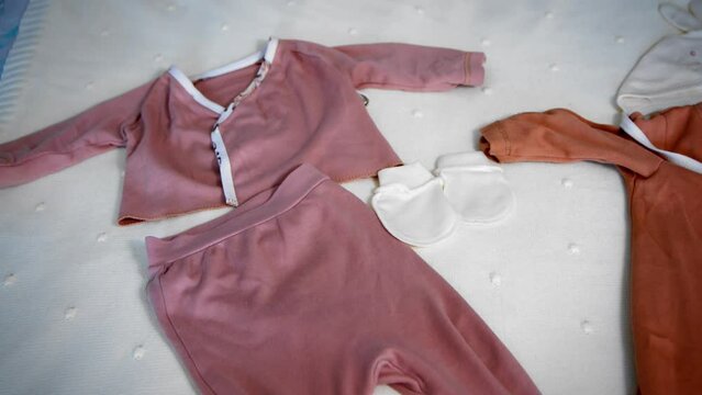 Children's clothes on the bed top view