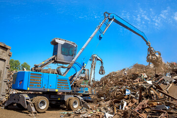 industrial grabber crane loading scrap metal