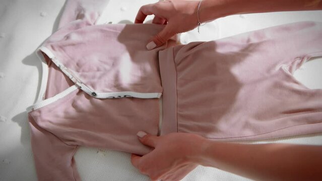 Children's clothes on the bed top view